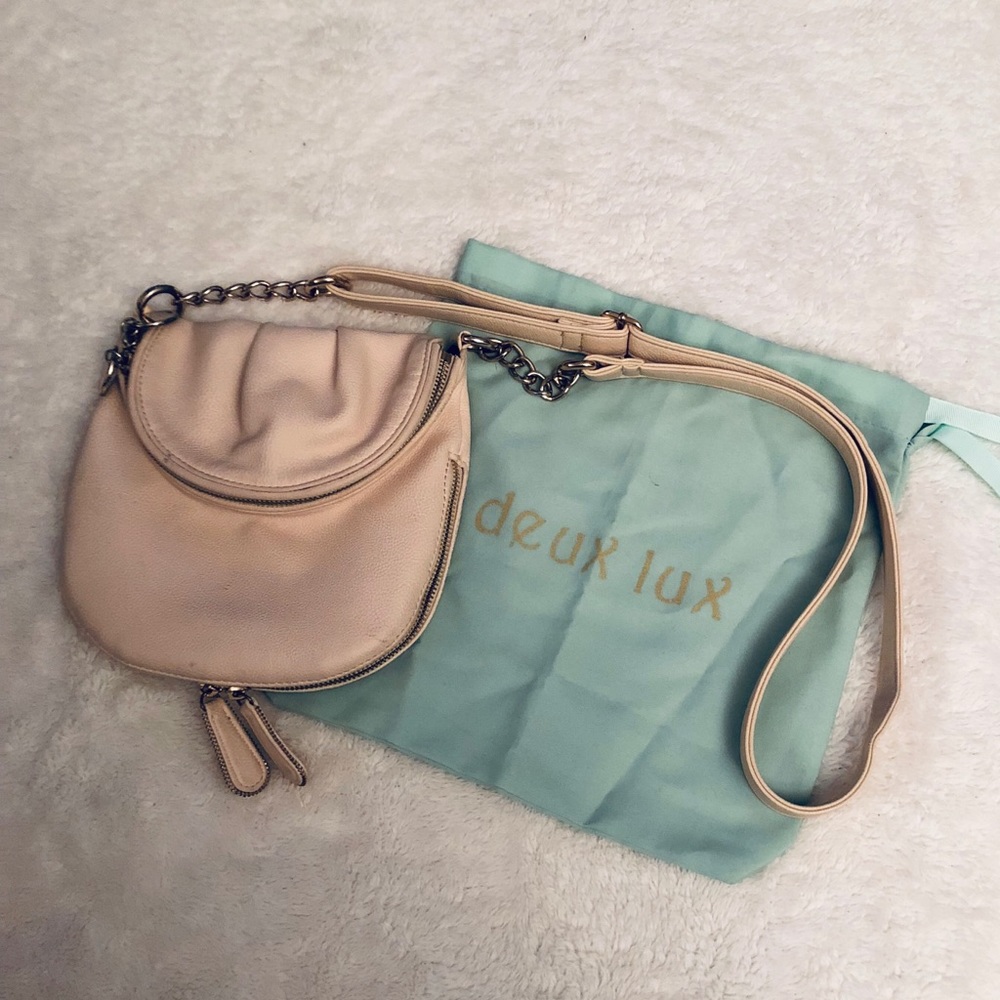 Expandable crossbody bag with neon interior